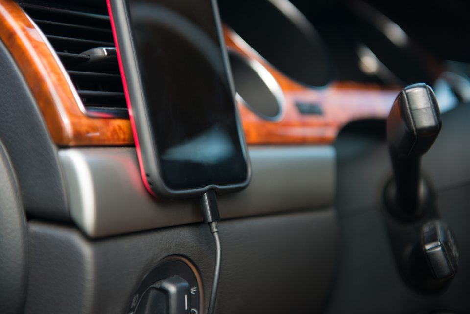 Cellphone charging on car A/C magnet mobile phone holder in use