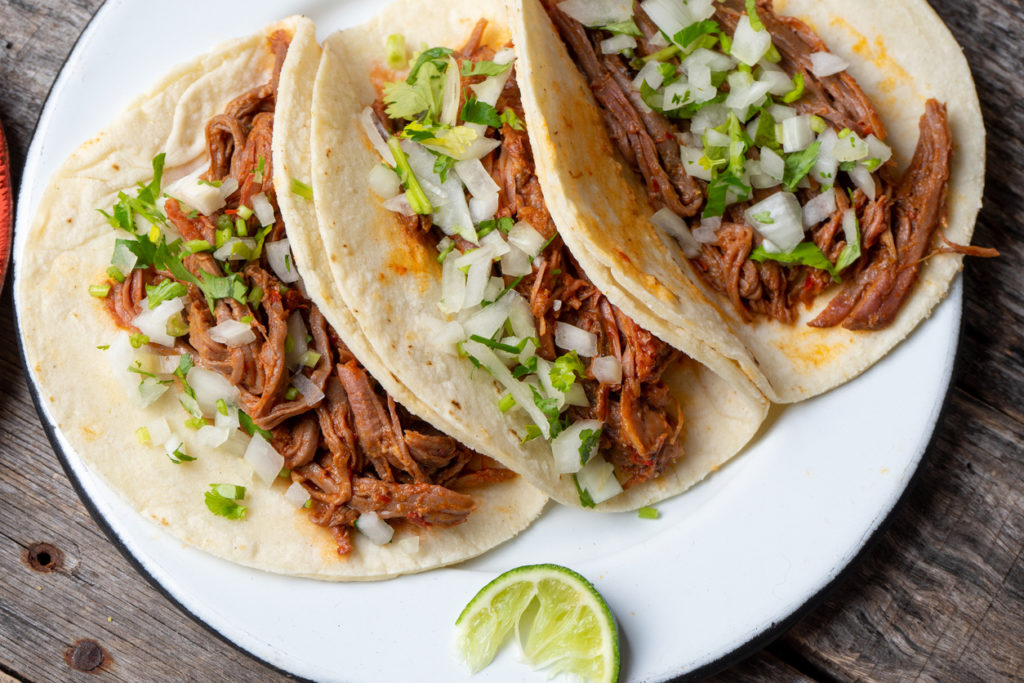 Traditional Mexican beef barbacoa tacos.