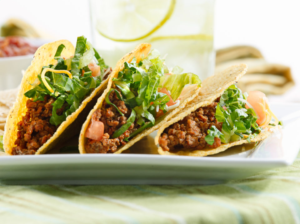 a platter of three tacos shot close up